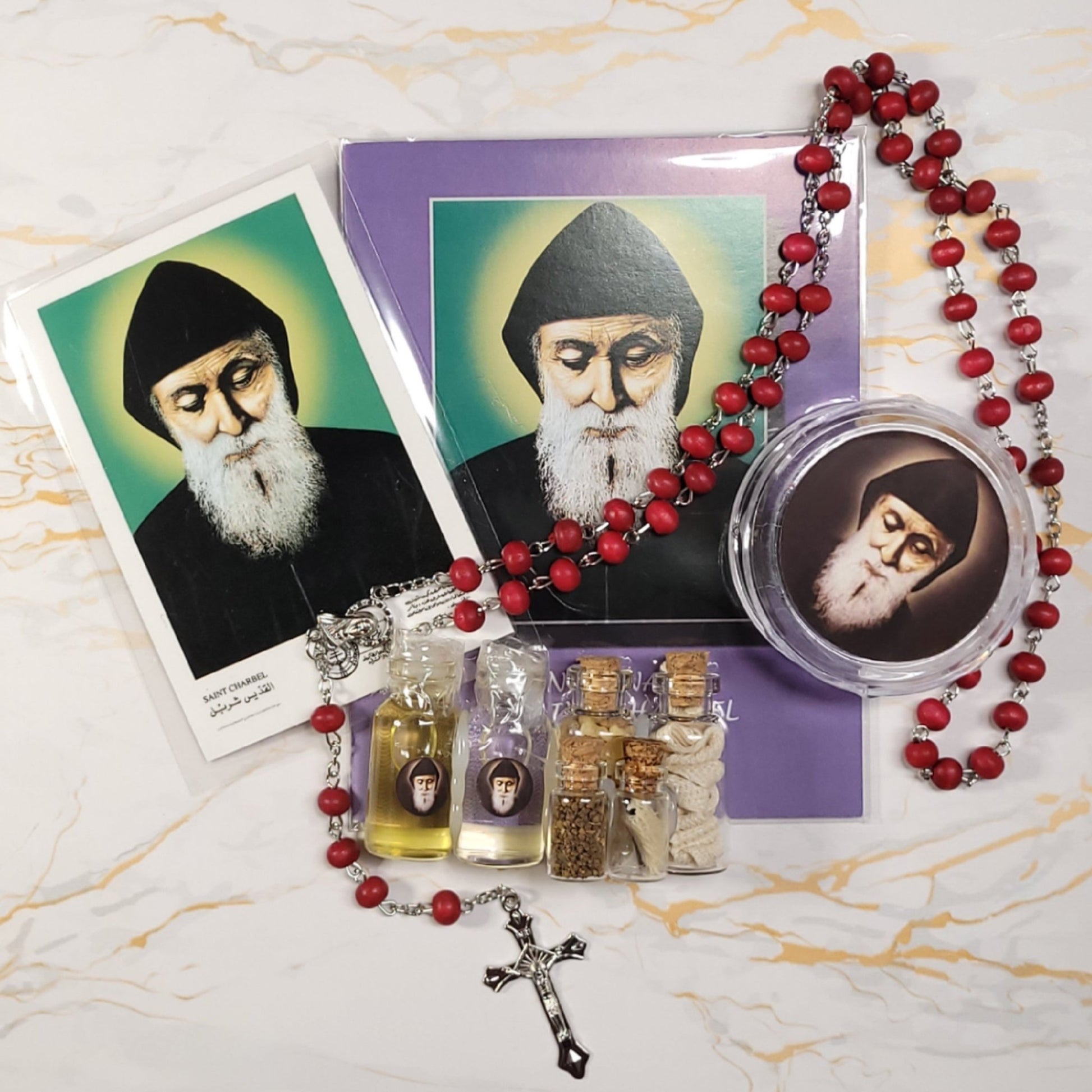 Set of oil, water, incense, soil, relic, rosary and novena booklet of Saint Charbel - Our Lady of Gifts